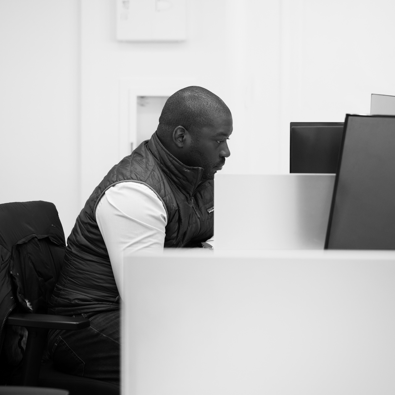 Translucent team member working at his desk in the New York City office