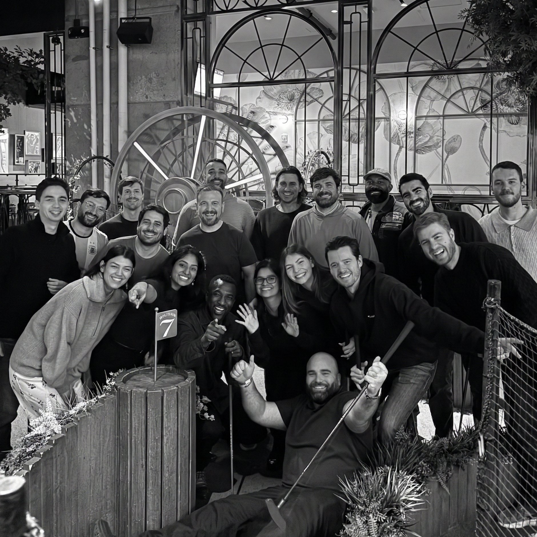 The Translucent team posing together during a mini-golf team outing