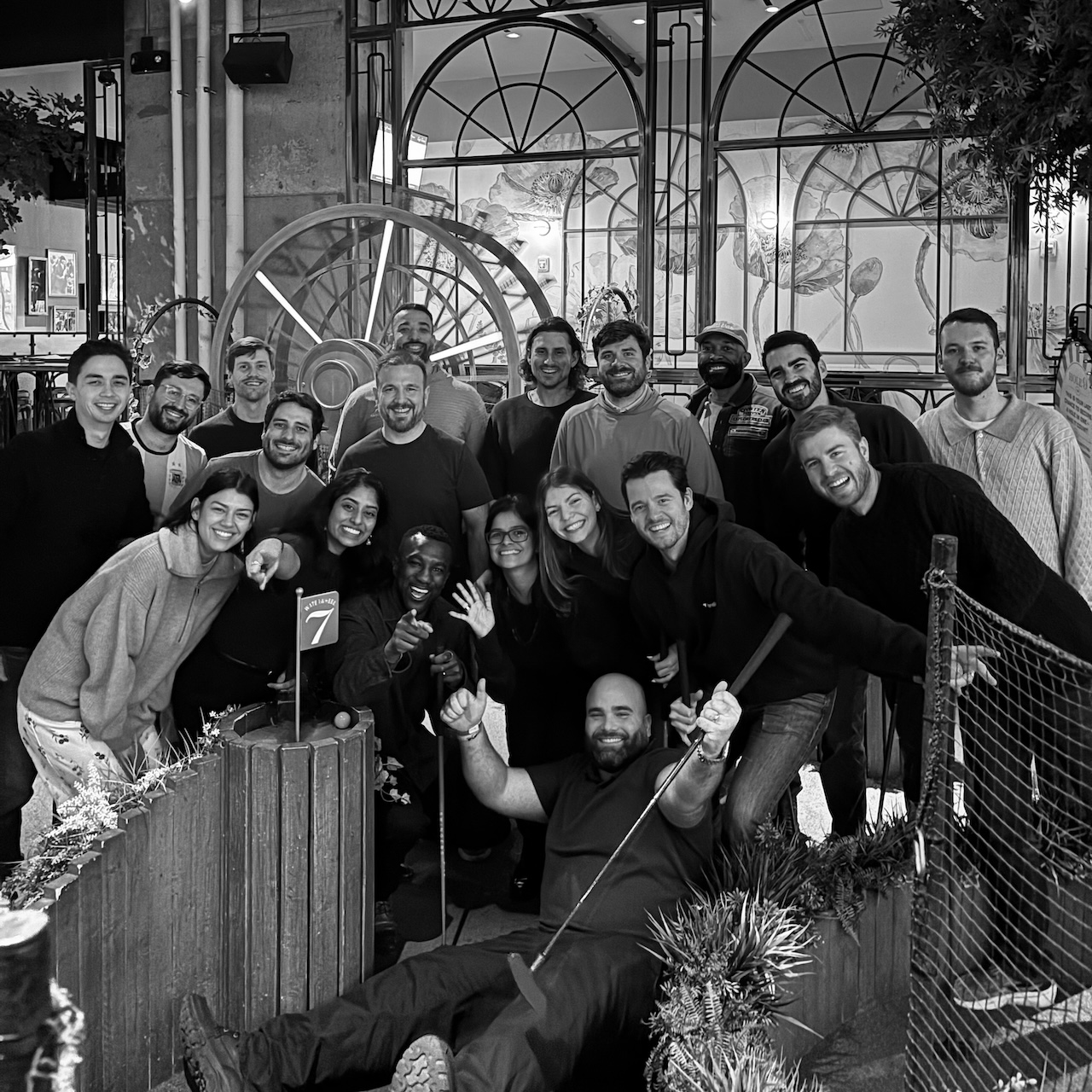 The Translucent team posing together during a mini-golf team outing