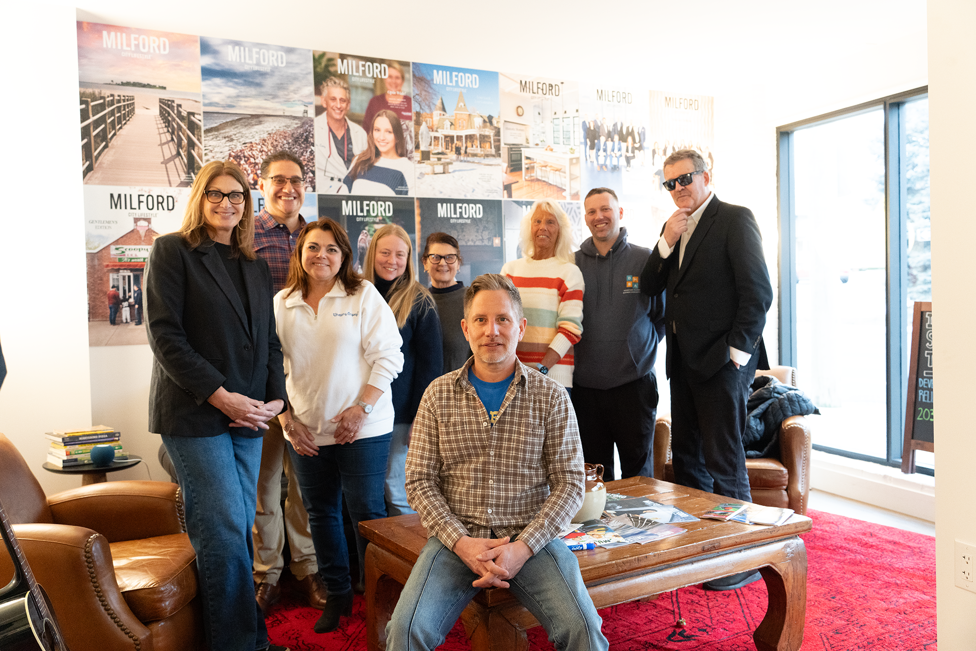 a group of people smiling and posing for a photo