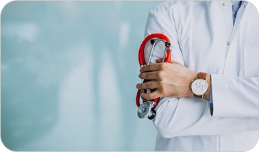 Doctor wearing a white coat holding a red stethoscope against a blurred blue background.