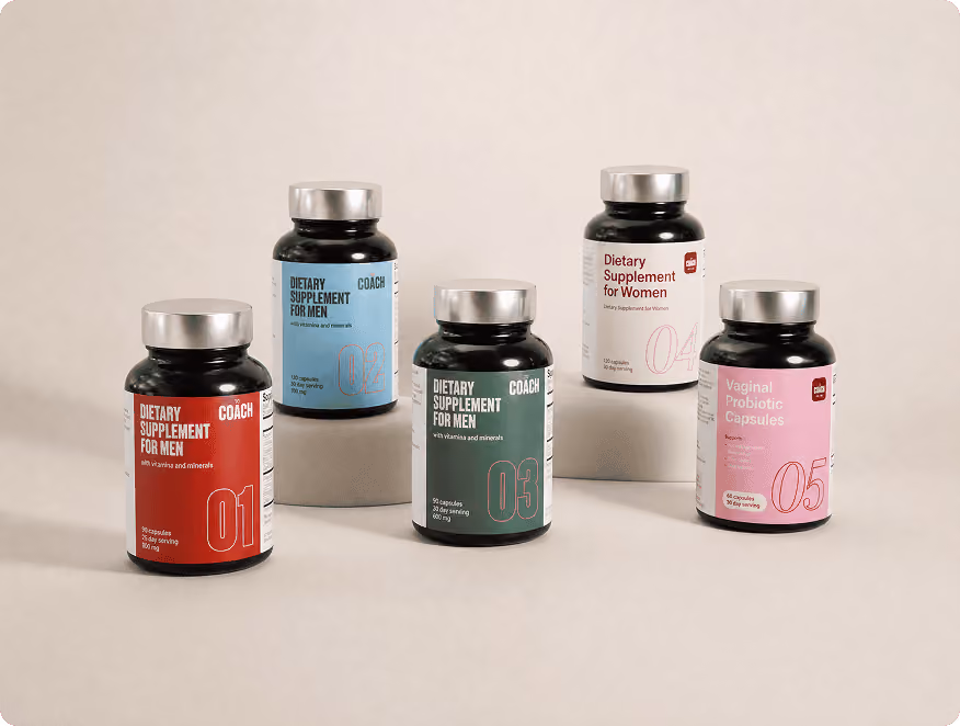 All five The Coach supplement bottles: men's Formulas 01-03 and women's Formulas 04-05