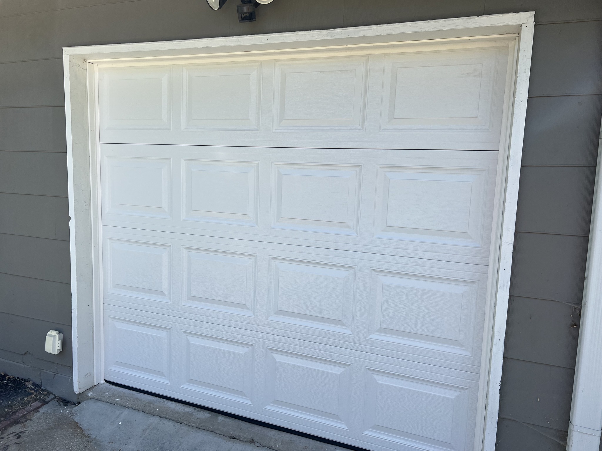 Exterior view of a newly installed Doorlink 410 garage door.