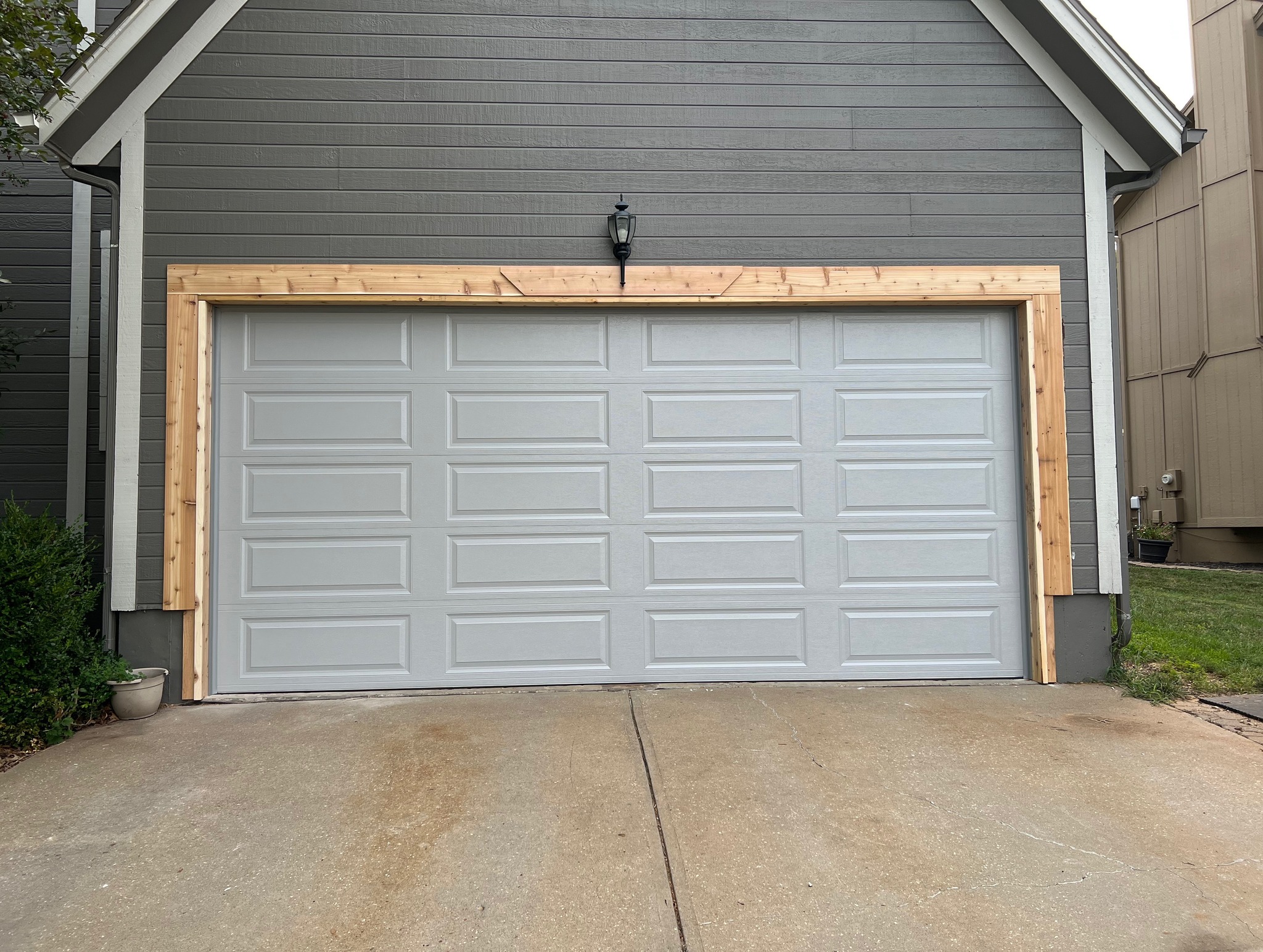 1 DoorLink 3650 in gray. Unpainted framing showing the garage door conversion