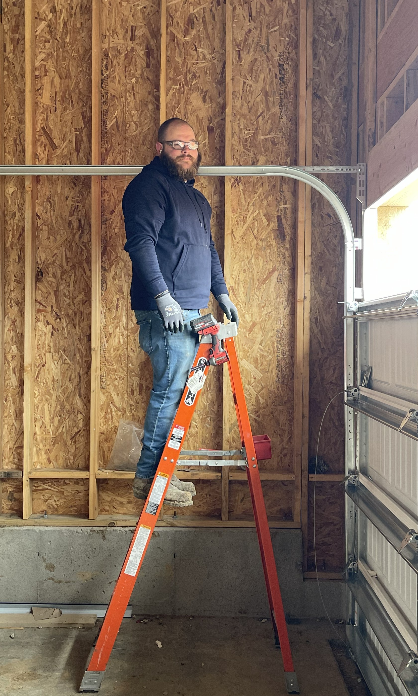 Valhalla Door Owner installing a 16x7 non-insulated garage door.