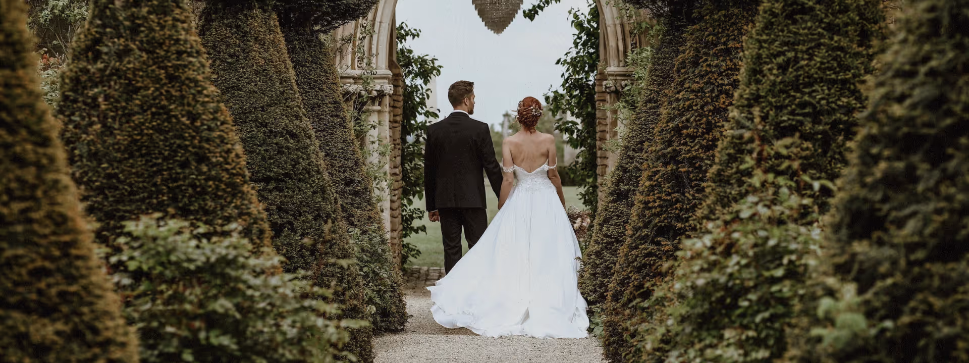 Euridge Couple Getting Married under the walk way arch