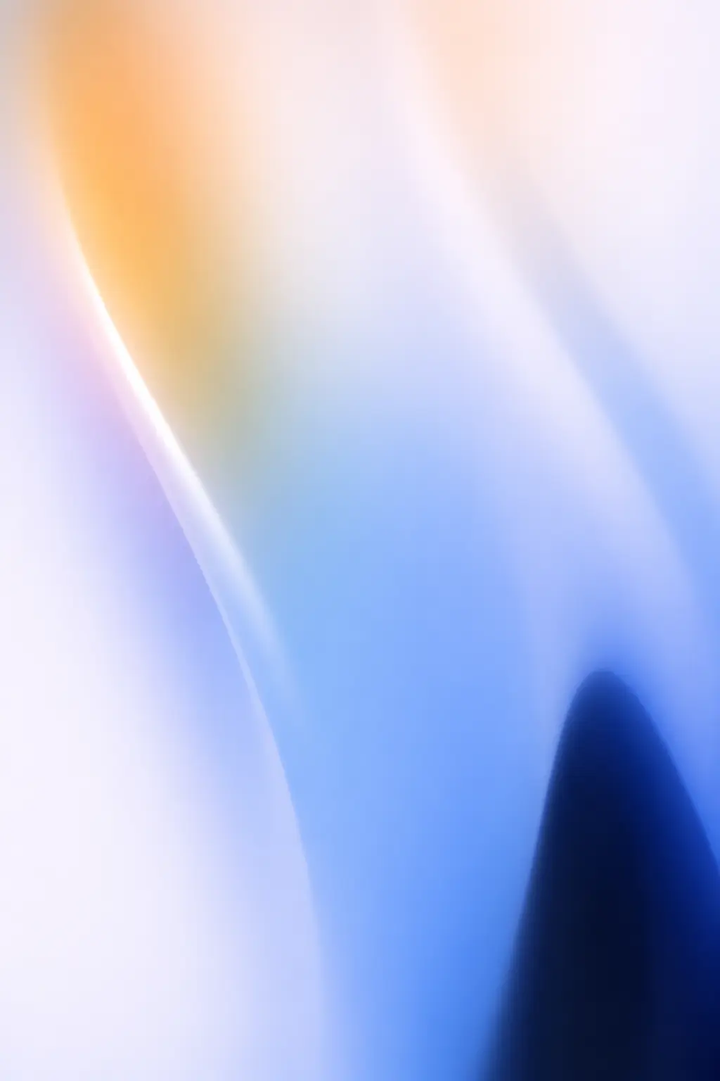 Abstract smooth gradient background with soft shades of blue, white, and orange blending together.