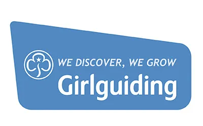 Girlguiding logo with a trefoil symbol and the text 'We discover, we grow Girlguiding' on a blue background.