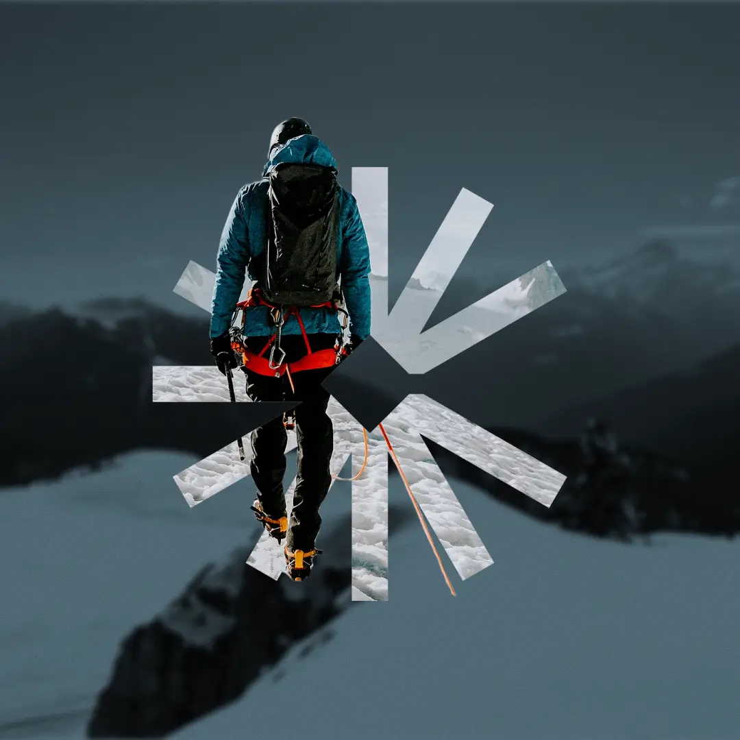 Person with climbing gear facing snowy mountain terrain with overlay of Cohort's logo.