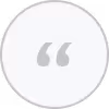 Gray quotation marks inside a white circle with a light gray border.