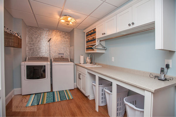 Hanover laundry room with a utility sink, countertop workspace, and dedicated drying area