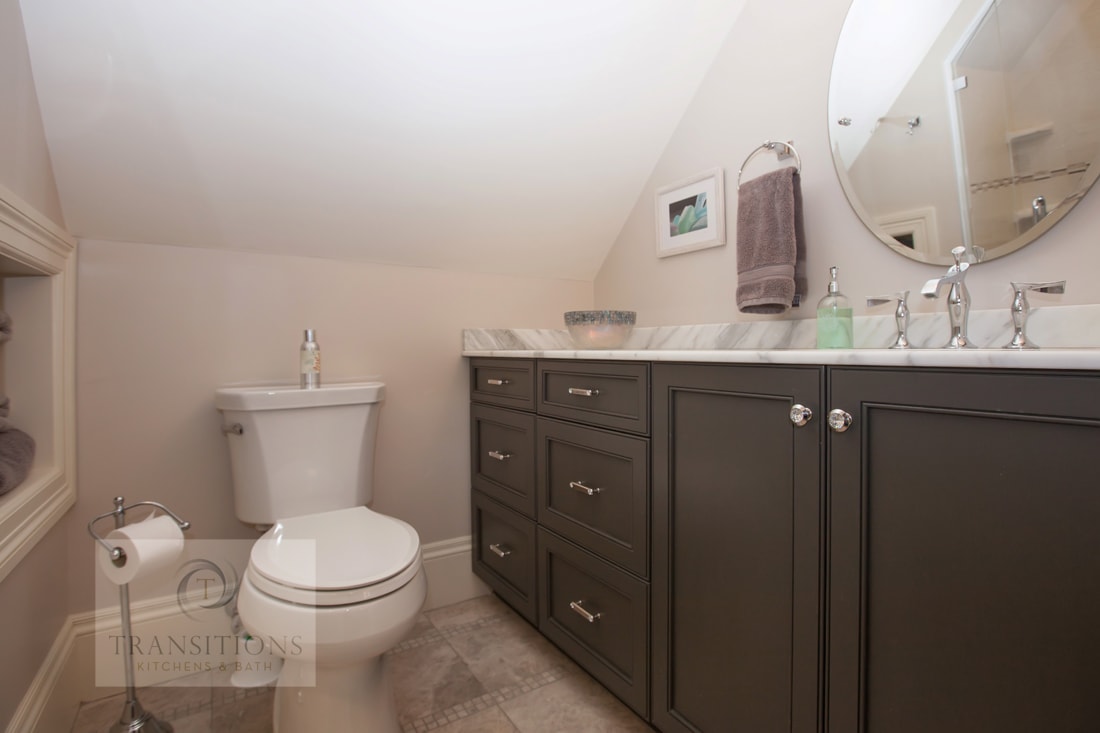 Hingham guest bathroom with a large walk-in shower, basket weave floor tile, and corner storage shelves