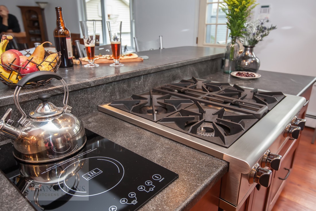 Dark gray countertop and backsplash detail in the Weymouth kitchen