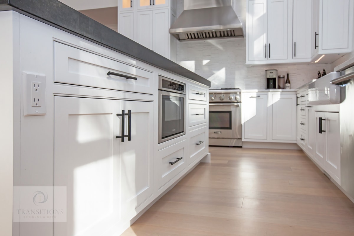 Contrasting island with seating in the modern Norwell kitchen
