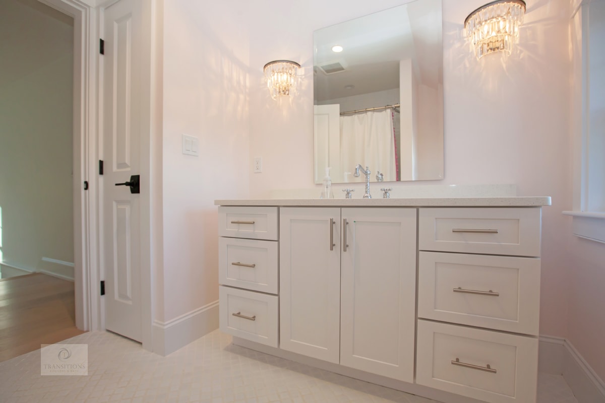 Norwell hall bathroom with a white Diamond Masterbrand vanity, Top Knobs brushed nickel hardware, and quartz countertop