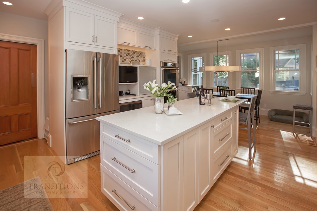 Contemporary Hingham kitchen with specialized storage inserts, island cabinetry, and custom shelves