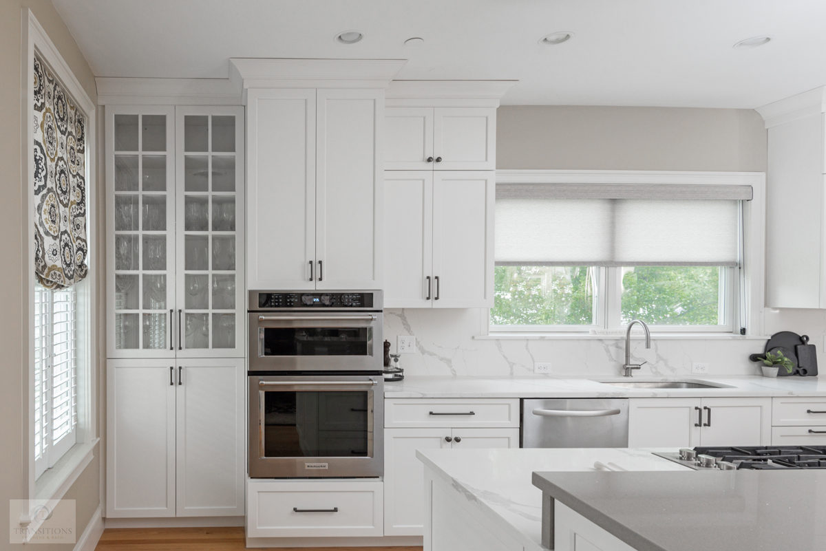 White Mouser cabinetry with Calacatta Rome quartz countertops in the Scituate kitchen