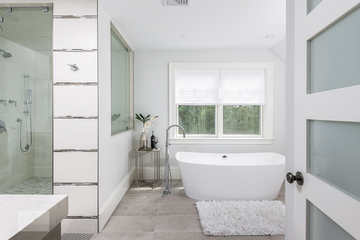 Wide view of the Weston primary bath with vanity, tub, and shower visible