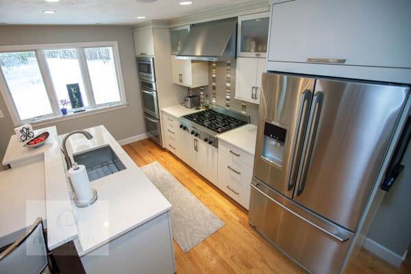 Wide view of the contemporary Hanover kitchen showing the full island and perimeter