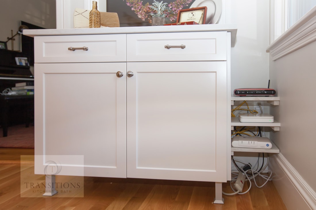 Kitchen cabinet with integrated electrical storage