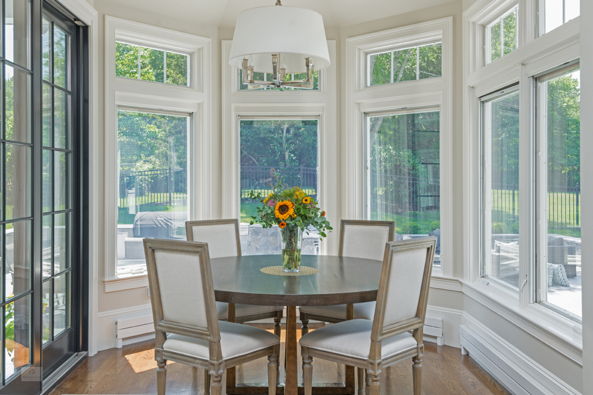 Glass-front upper cabinets with in-cabinet lighting in the Milton kitchen