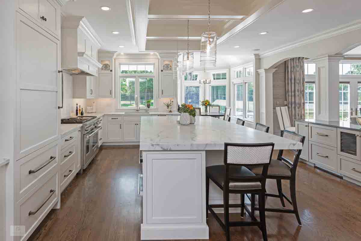Wide view of the traditional Milton kitchen with white perimeter and gray island