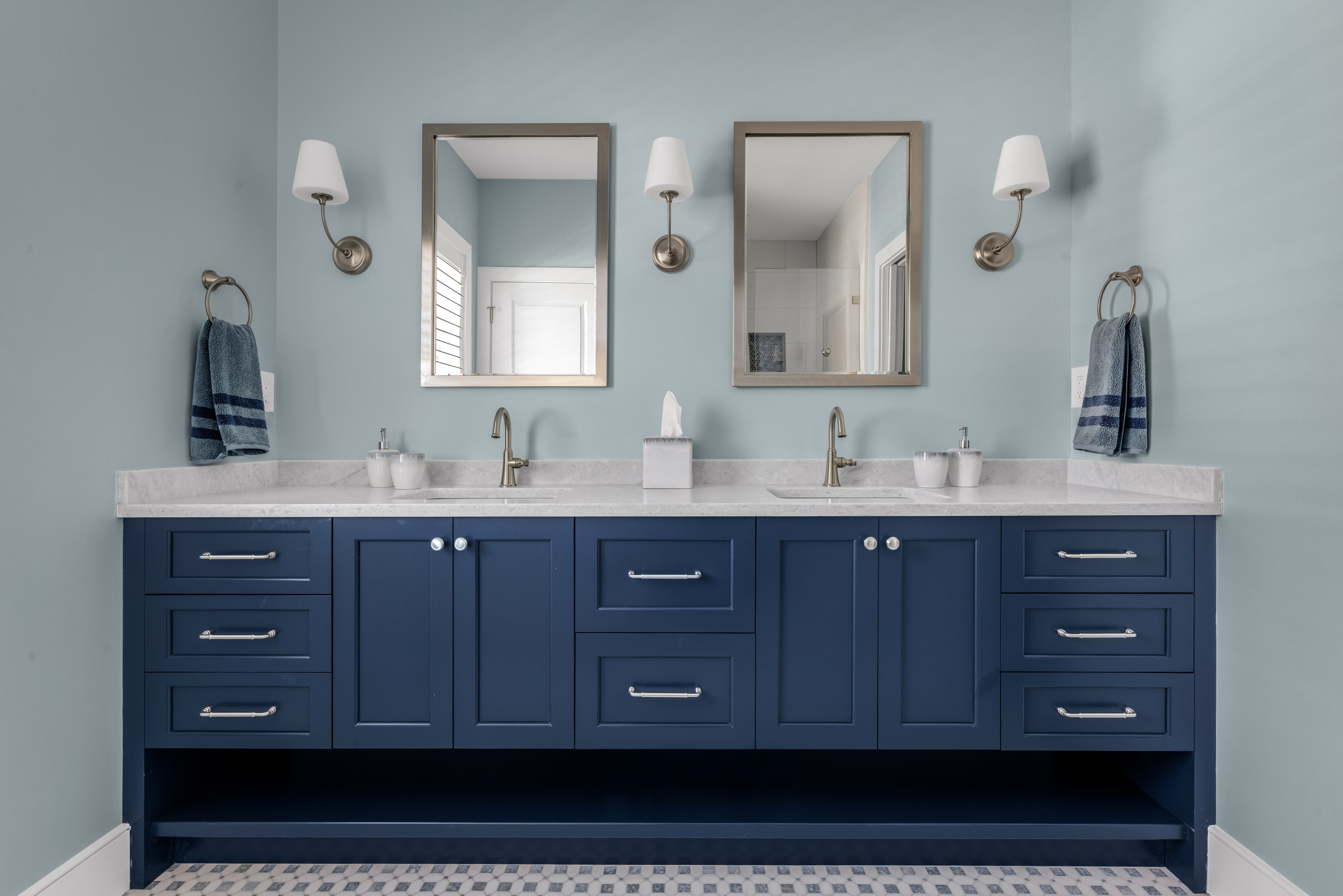 Primary bath with Tedd Wood double vanity in Naval finish and walk-in shower
