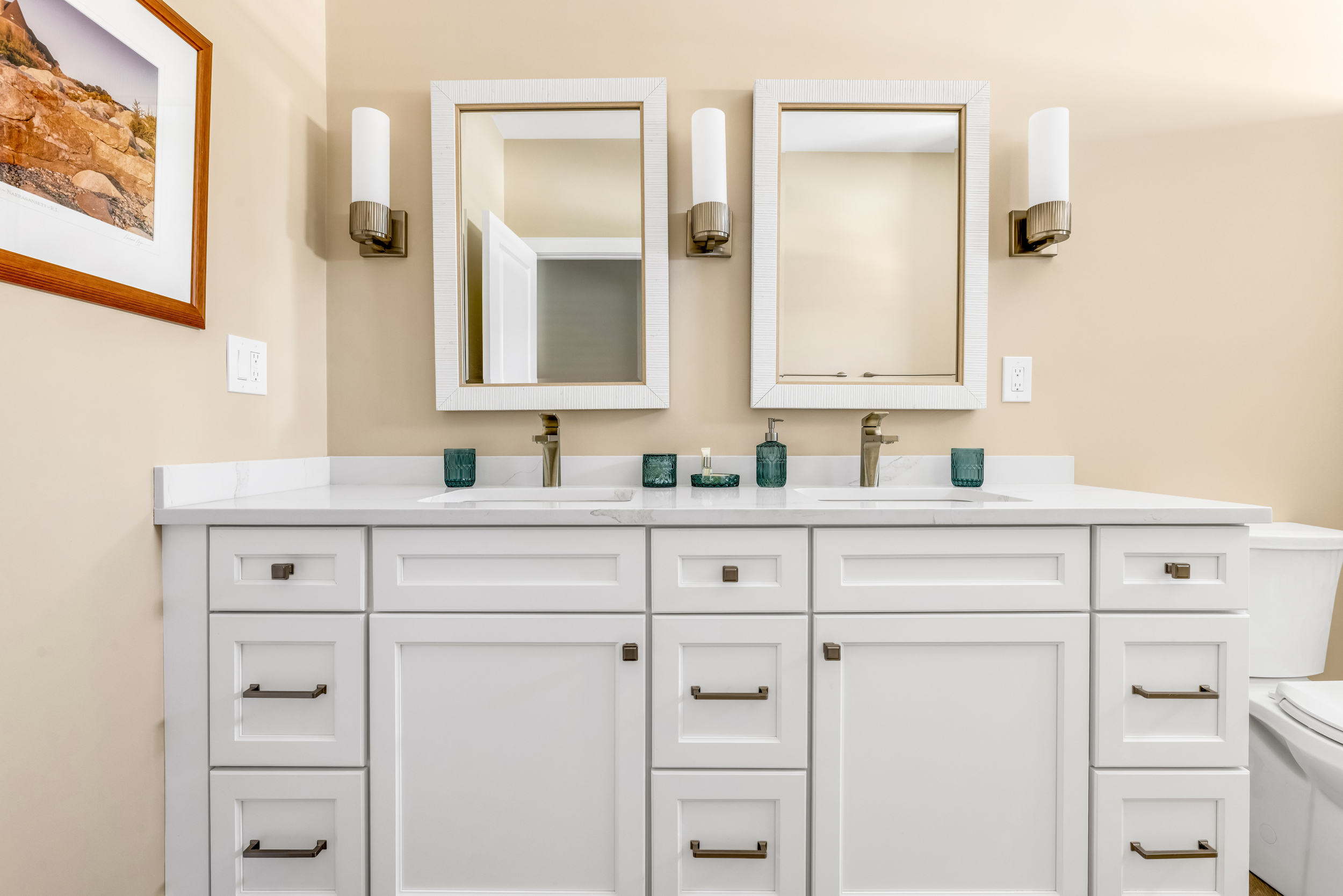 Powder room with patterned wallpaper and Tedd Wood vanity