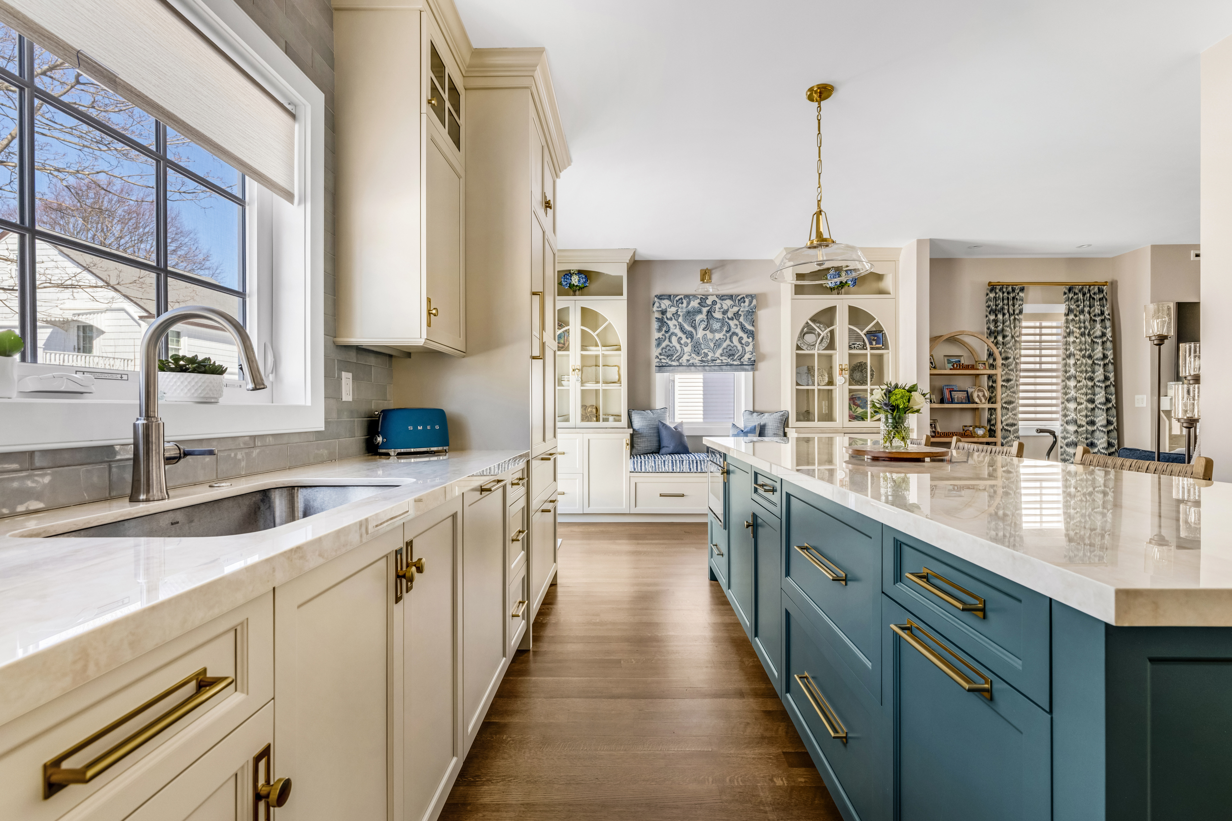 Open-plan living area with the kitchen visible in the background