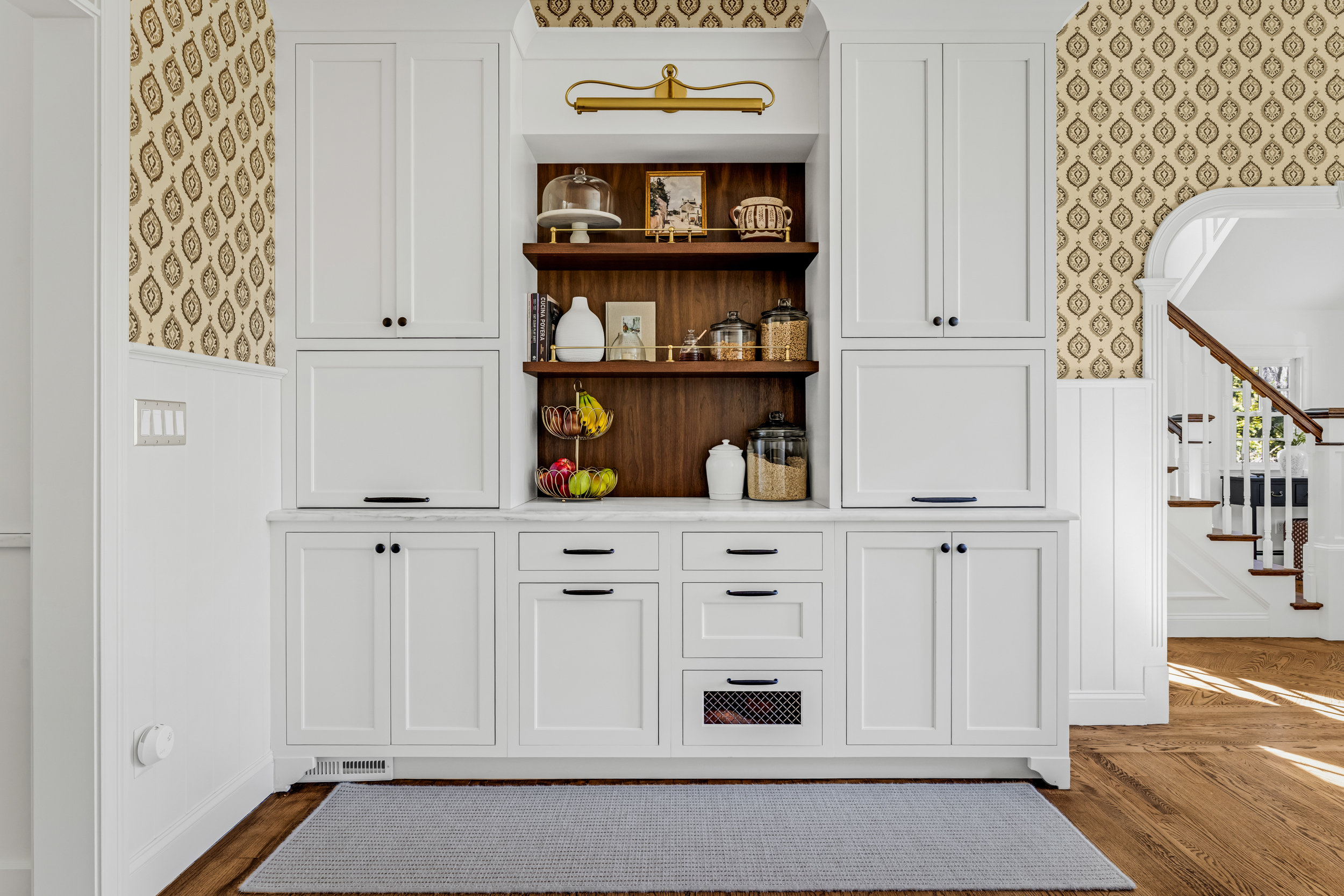 Norwell dining area with built-in hutch-style cabinetry wall in white