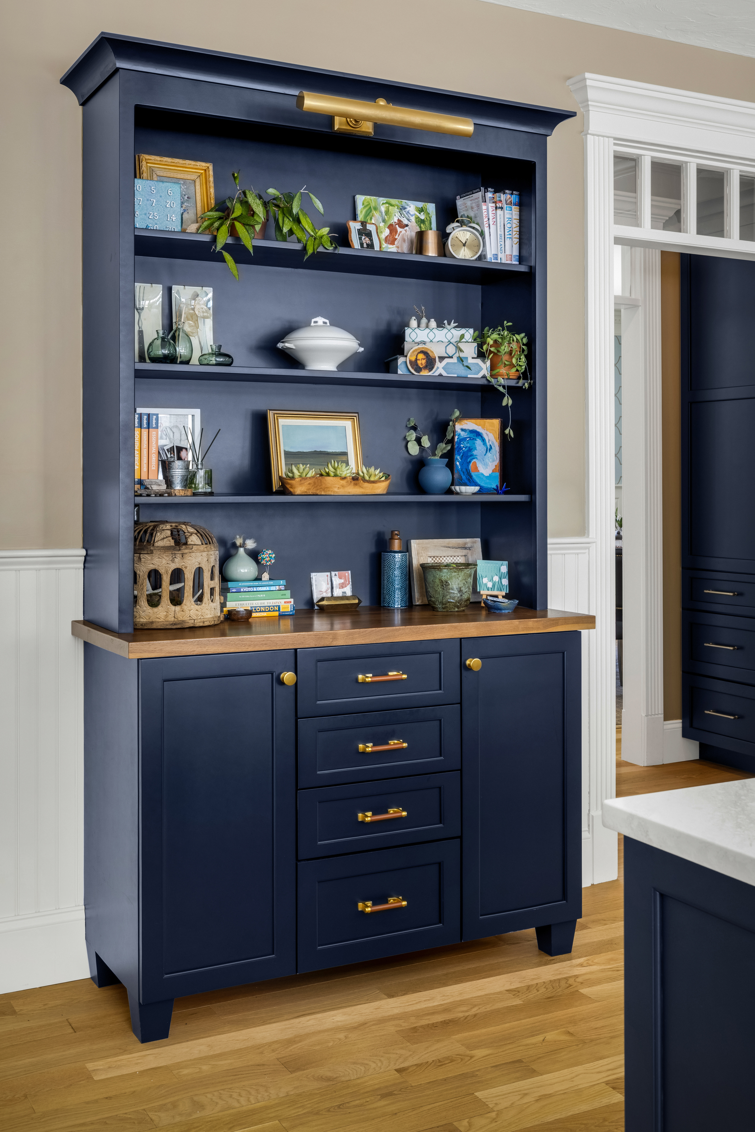 Dedicated bar area with matching navy cabinetry and patterned backsplash
