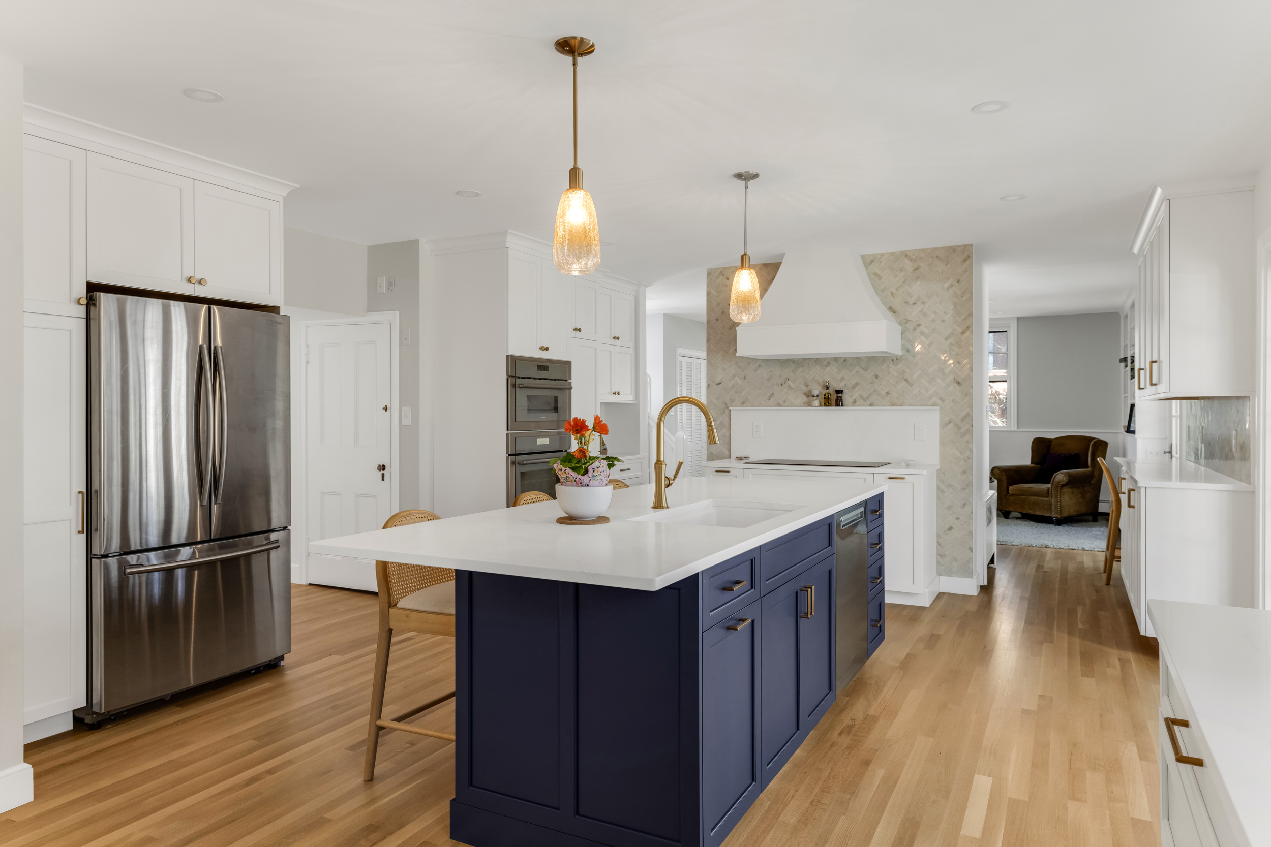 Pull-out spice cabinet with three full-extension tiers next to the cooktop