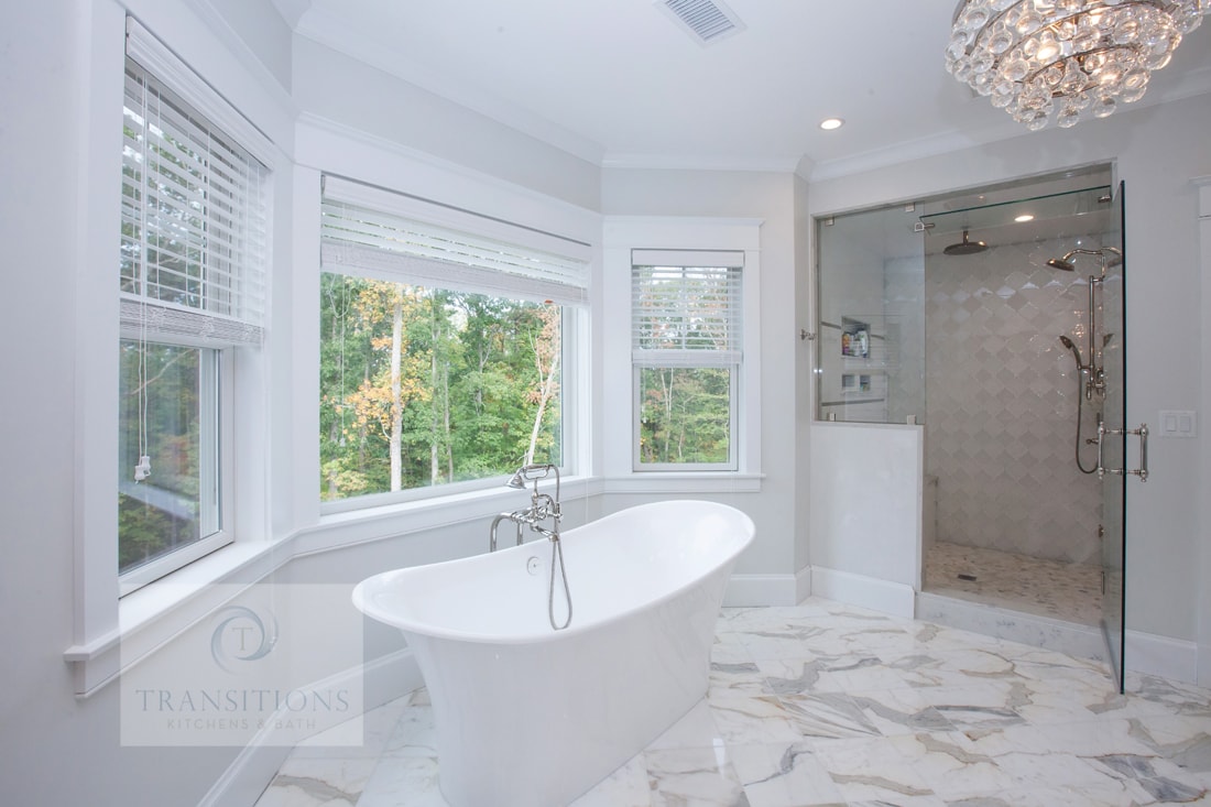 Bath design with freestanding tub on a tile platform