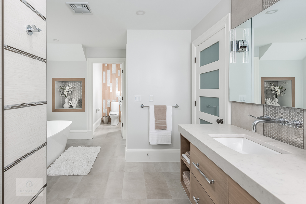 Weston primary bath with a Tedd Wood wall-mount vanity, freestanding tub, and full spa-style shower