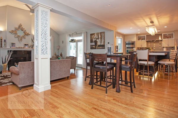 Contemporary Hanover kitchen with a T-shaped multi-level island, espresso island cabinetry, and glass-front upper cabinets