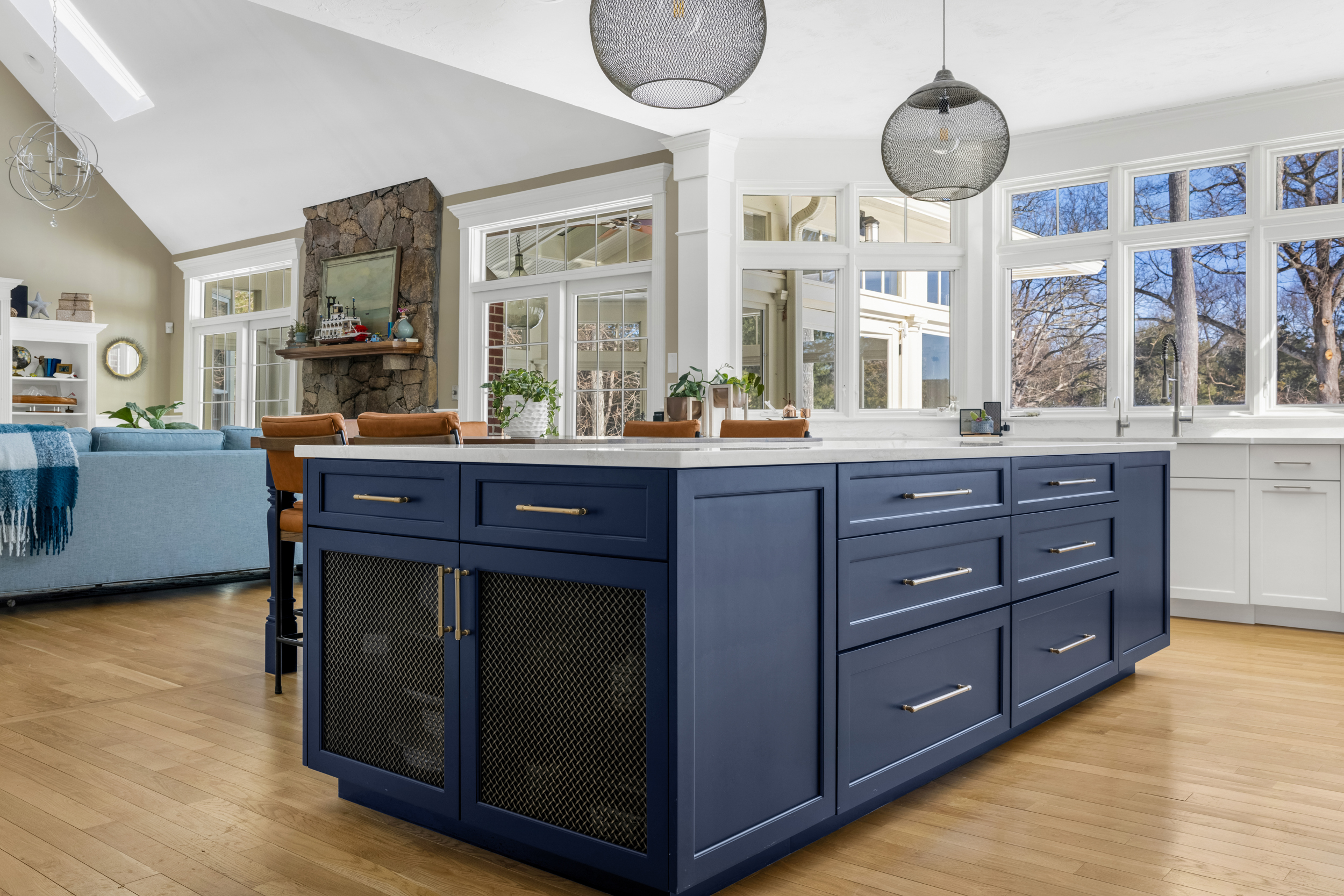 Norwell kitchen with Mouser cabinetry, navy island with mesh-front cabinet doors, and white quartz countertops