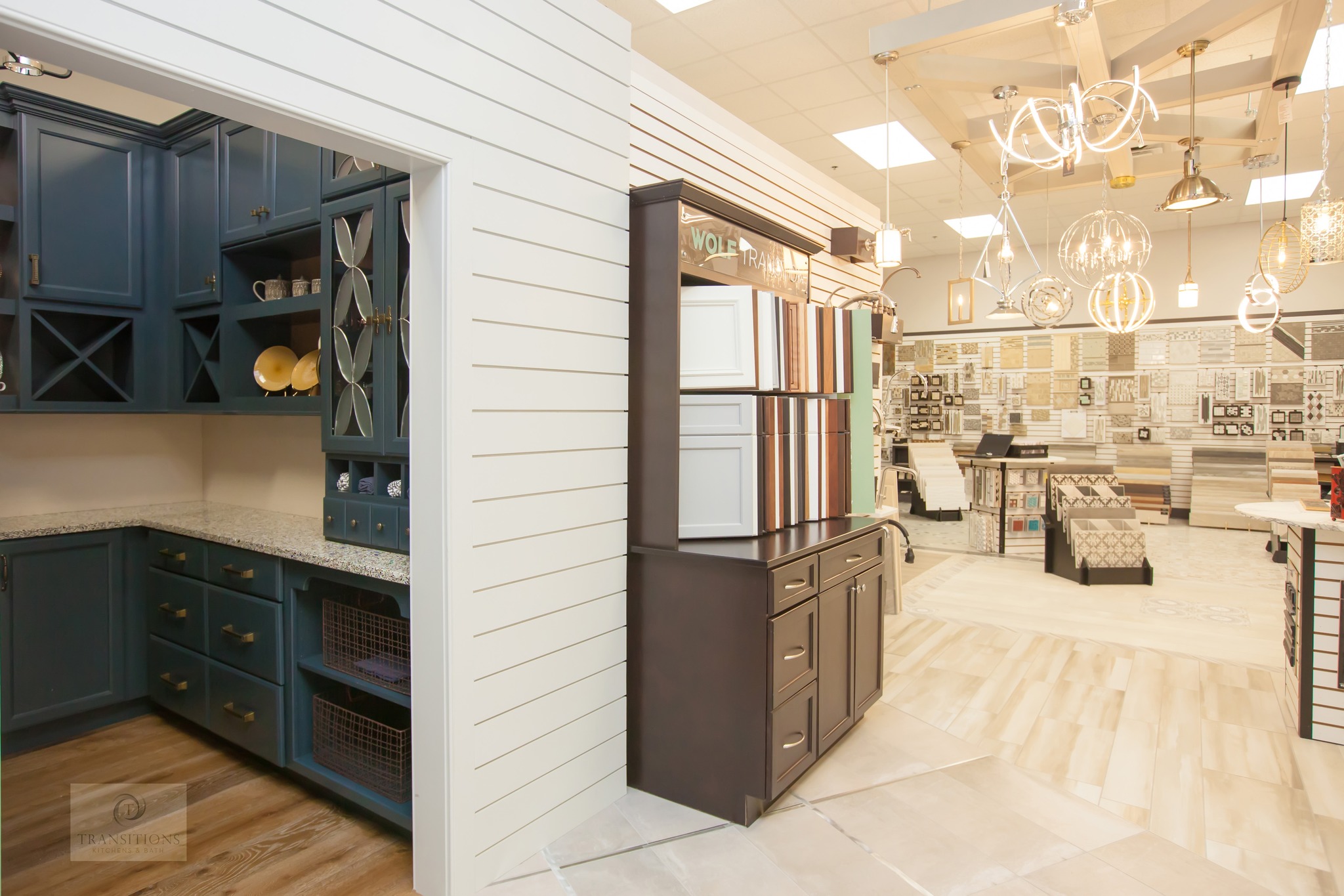 Tile and lighting display section inside the Transitions showroom in Norwell MA