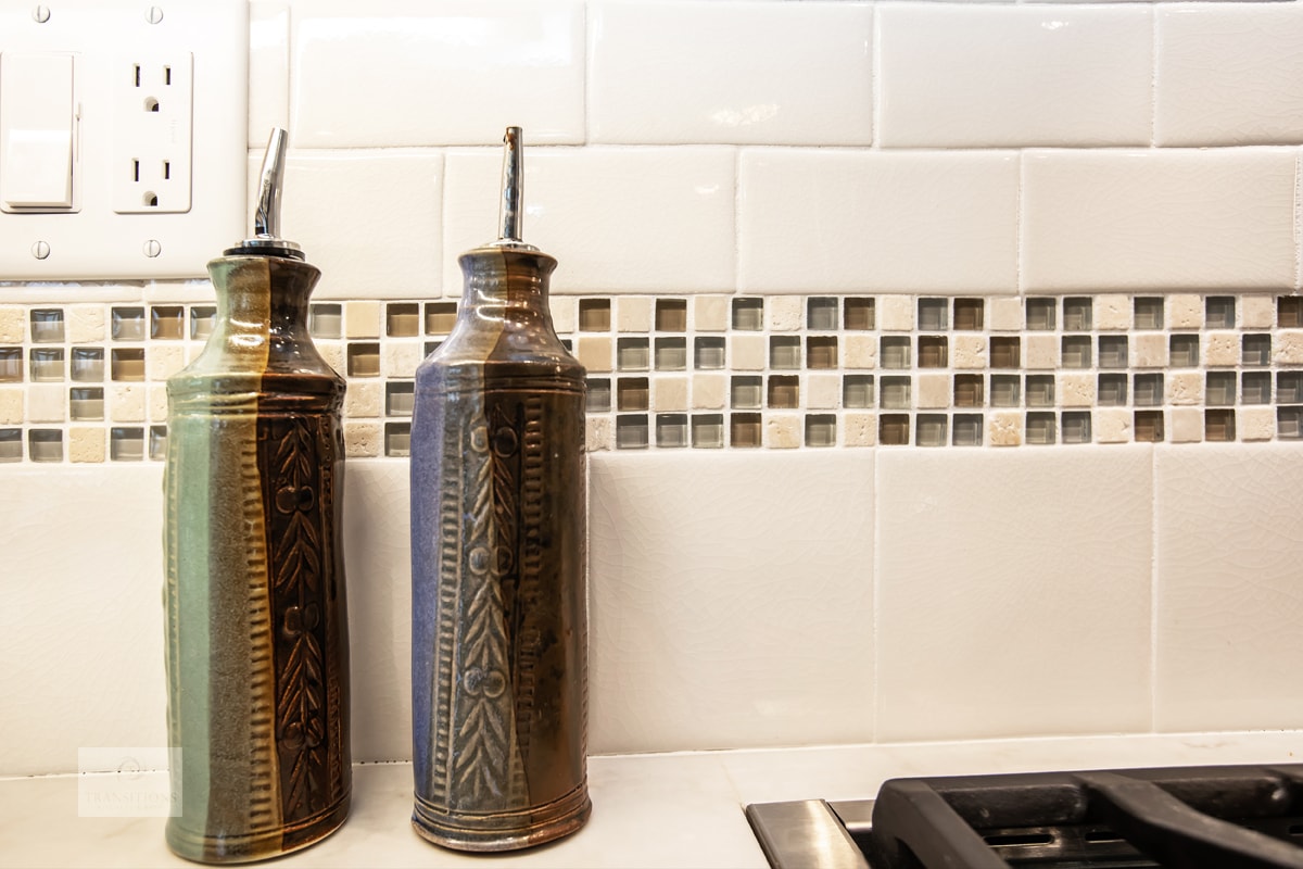 Neutral color scheme tile backsplash in a Massachusetts kitchen