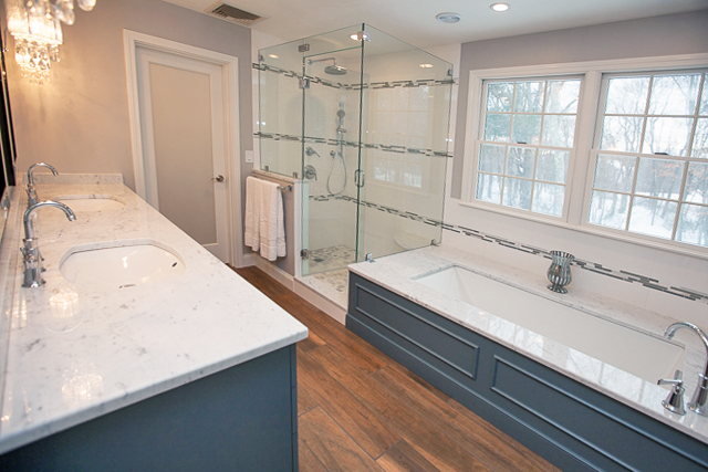 Bathroom design with tub by window
