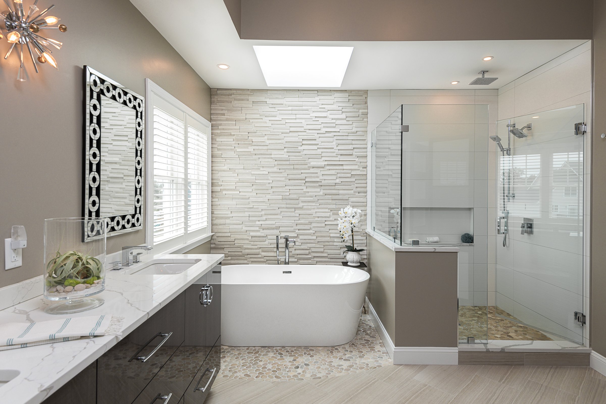 wide shot, vanity + tub + stacked stone wall