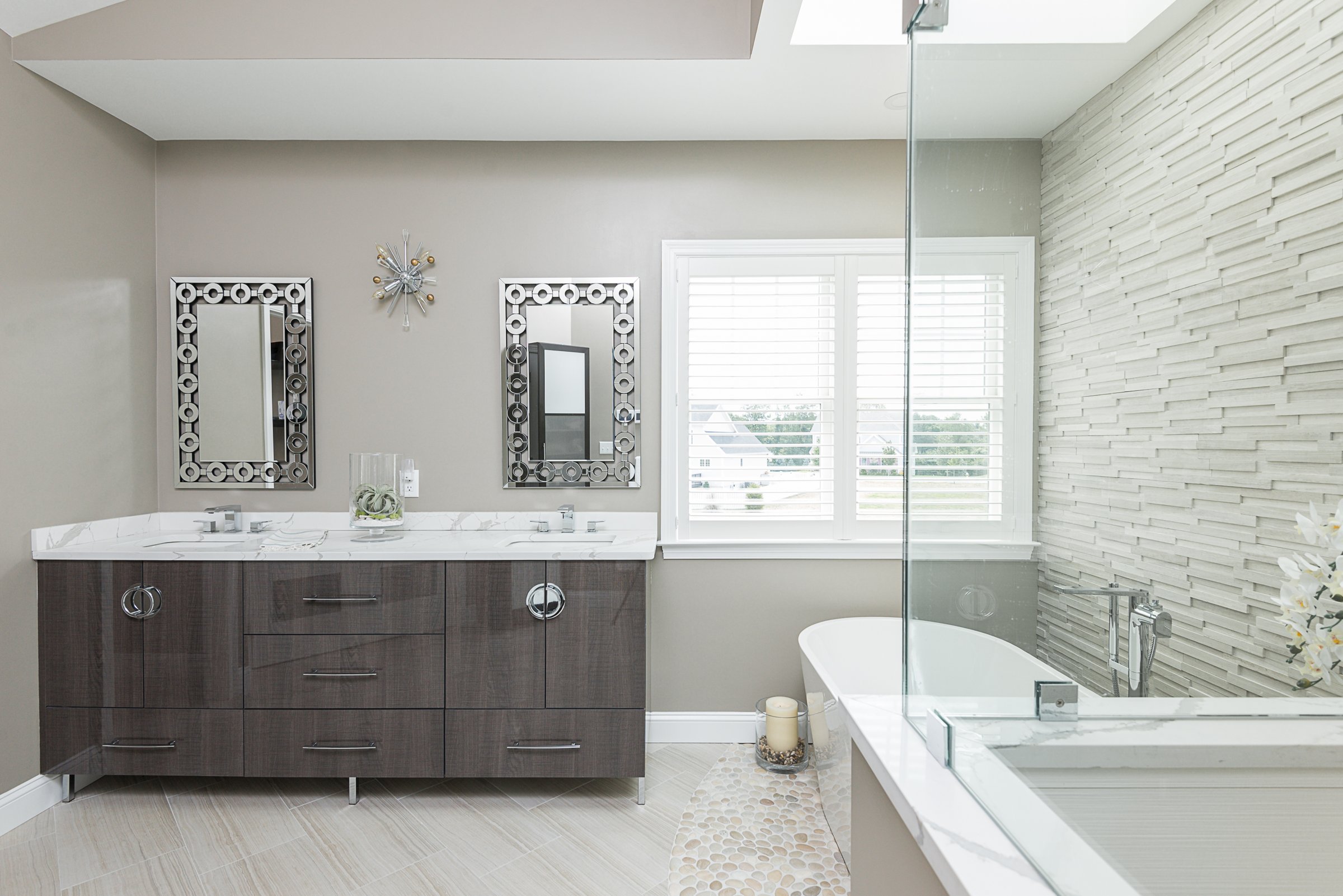 wide shot, vanity + shower + stacked stone wall