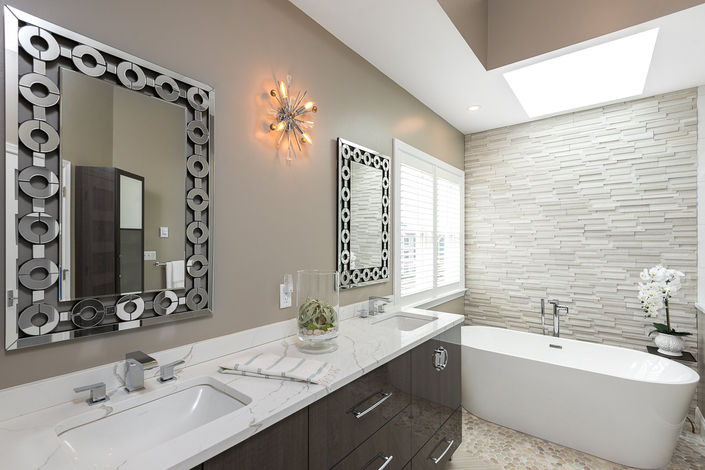 wide shot, vanity + tub + stacked stone wall