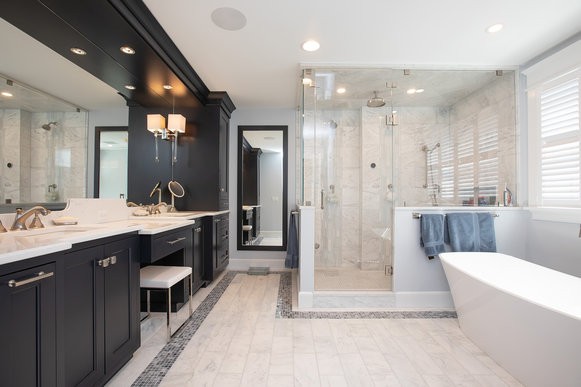 Hingham primary bath with black Mouser double vanity, marble shower, and Victoria and Albert freestanding tub