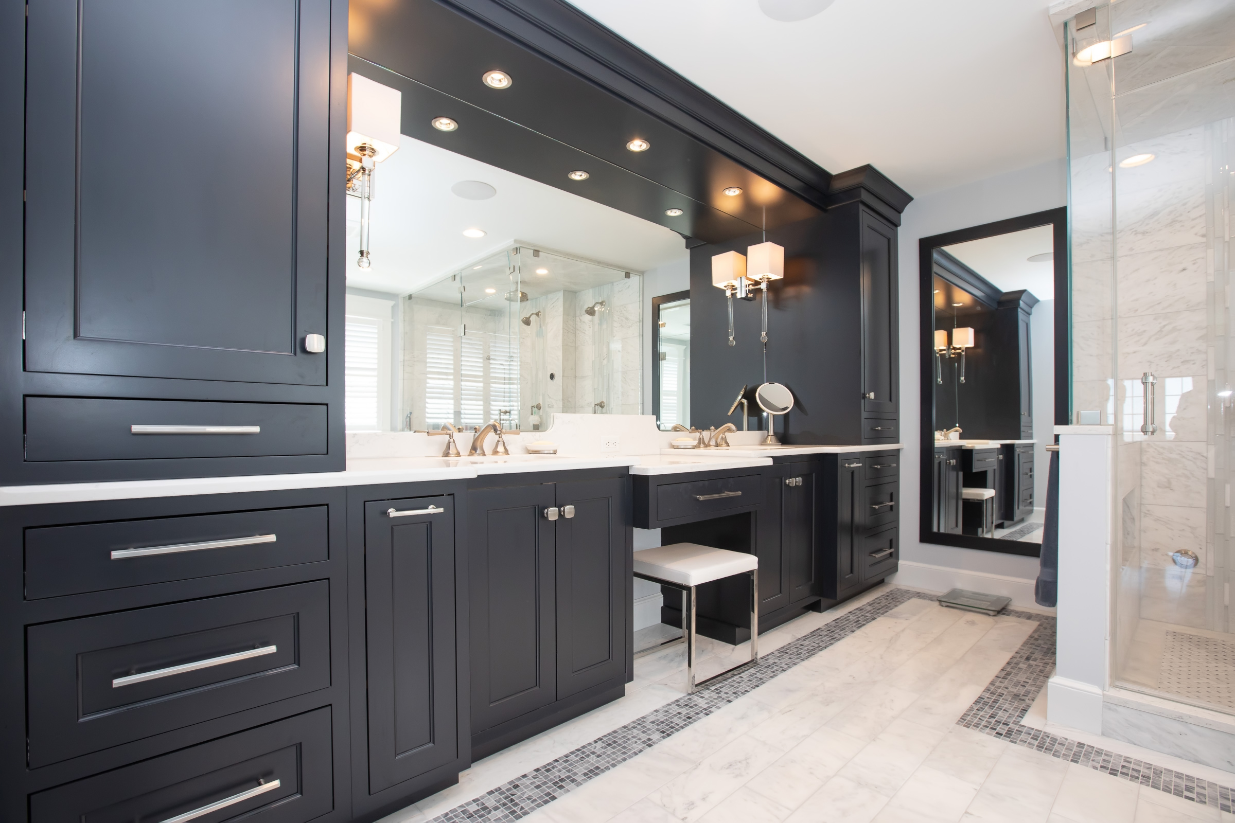 Black Mouser double vanity with white quartz countertops and tall storage tower in the Hingham primary bath