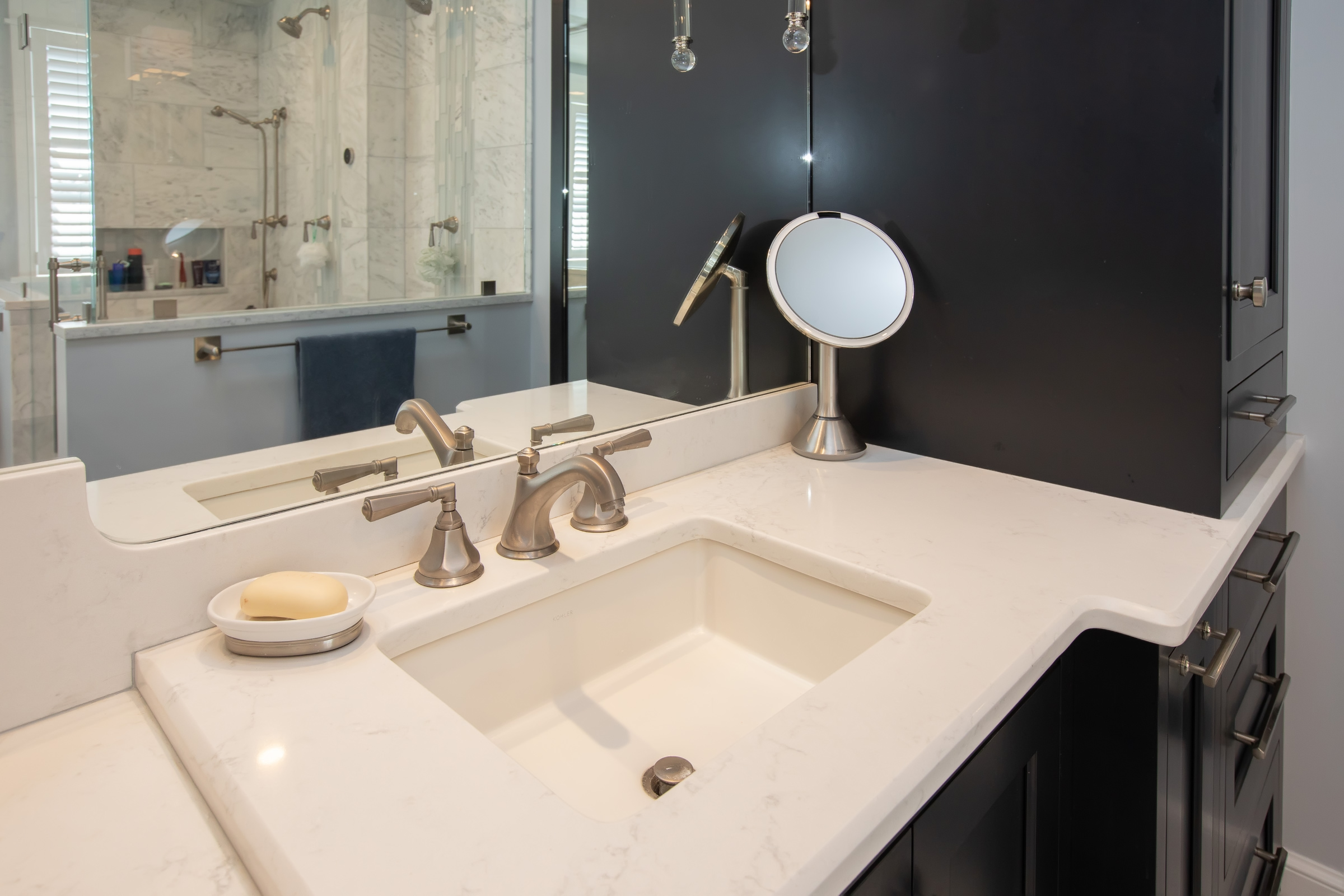 White quartz vanity with Kohler undermount sink and brushed nickel widespread faucets in the Hingham primary bath