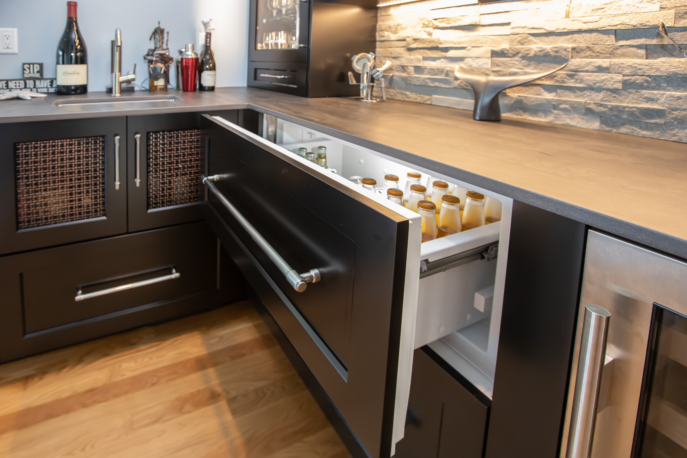 Custom bar cabinetry with wine storage in the Hingham first floor remodel