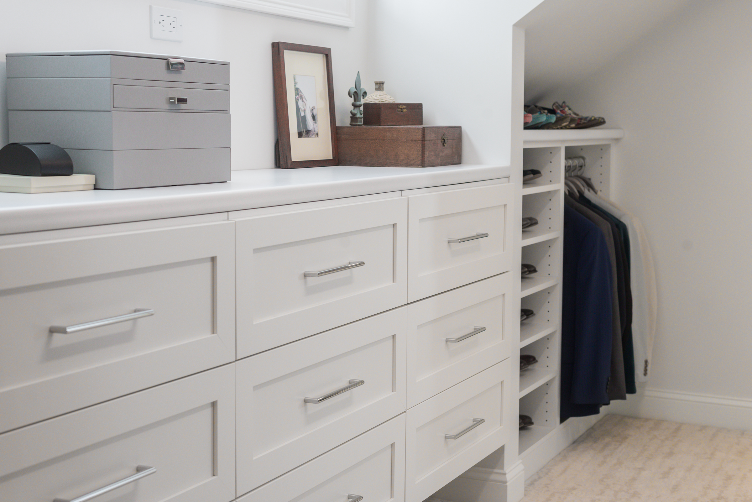 Custom Plus Closet system with white shaker drawers and shoe storage in the Norwell walk-in closet