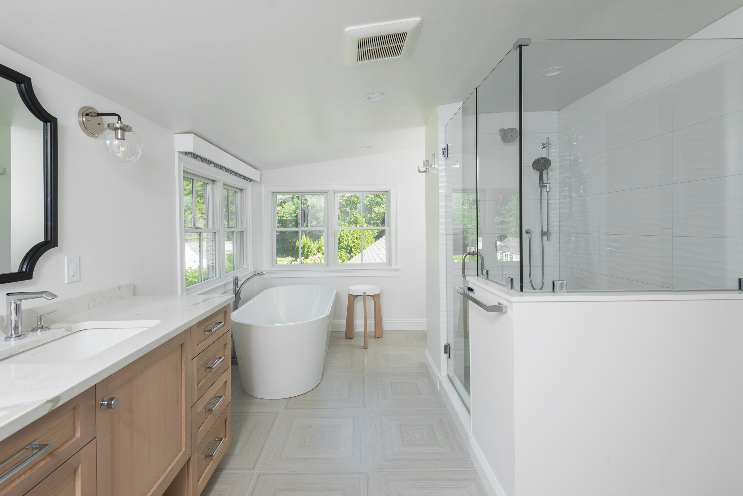 Norwell primary bath with white oak Tedd Wood vanity, freestanding tub, and walk-in glass shower