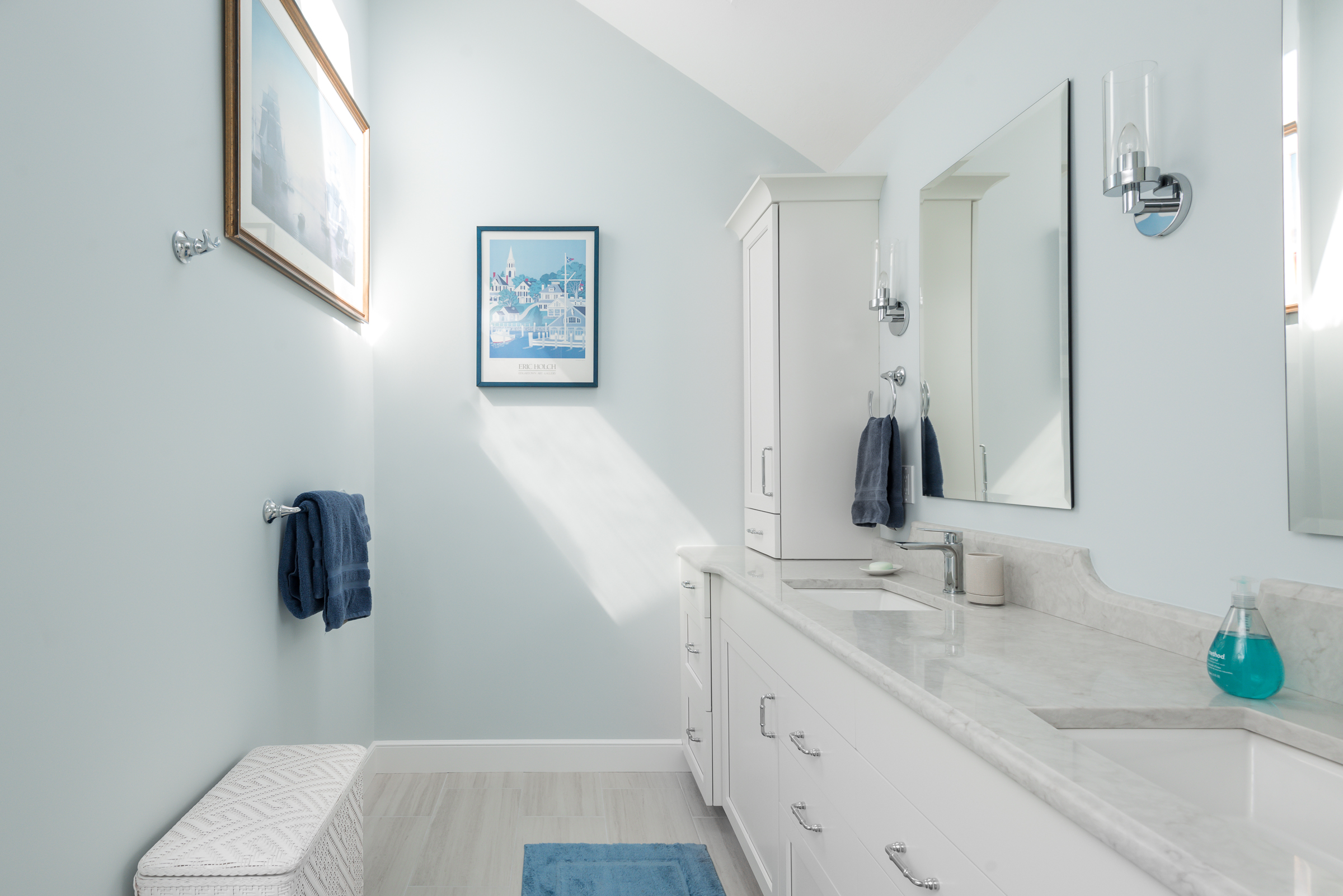 White double vanity with cabinet towers and chrome sconces in the Hingham coastal primary bath