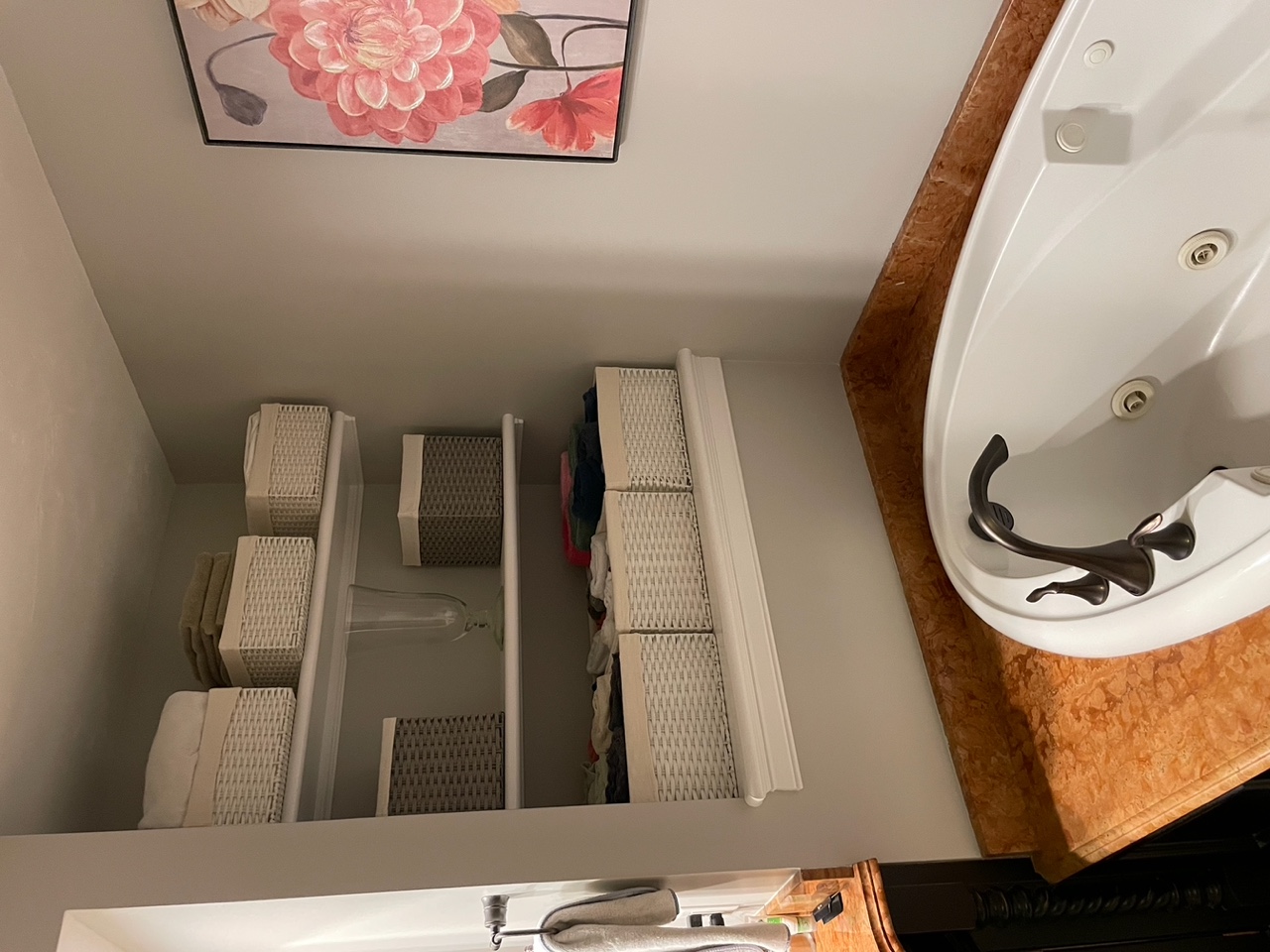 Before renovation: recessed shelf storage beside the drop-in jacuzzi tub in the original Braintree bath.